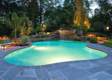 Evening pool with landscape lighting